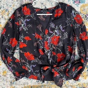 Black floral crossbody blouse. Easy for work or out to dinner!